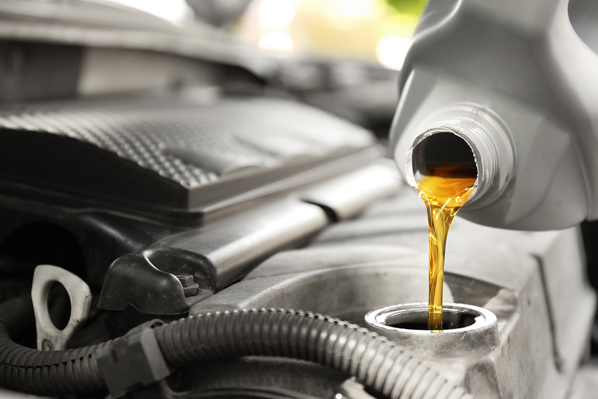 pouring synthetic oil